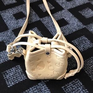 Cream Mini Bucket Crossbody with Embossed Motifs